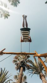 Low angle view of golden gate against sky