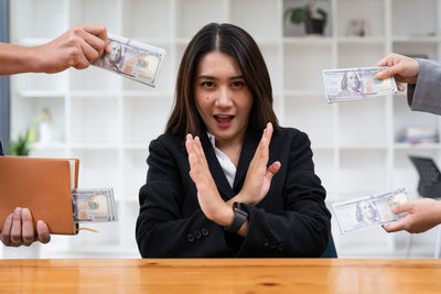 Portrait of young businesswoman working in office