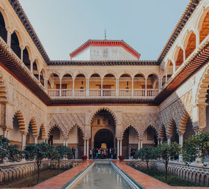 Patio de maidens courtyard inside alcazar of seville royal palace, spain.