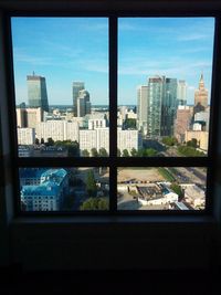 Modern buildings in city against sky