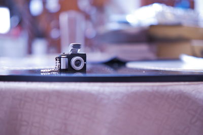 Close-up of camera on table