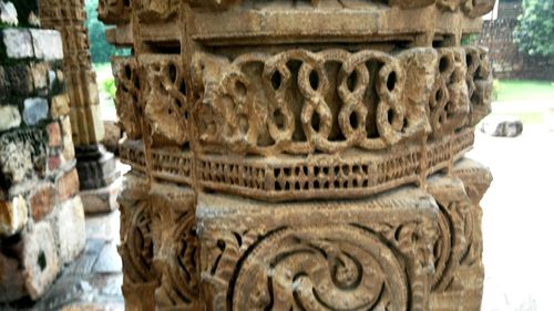 Row of objects on tiled floor