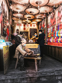 People standing at market stall