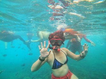 People swimming in sea