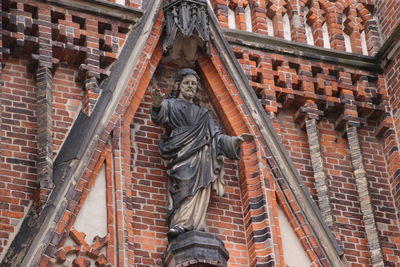 Low angle view of statue of historic building