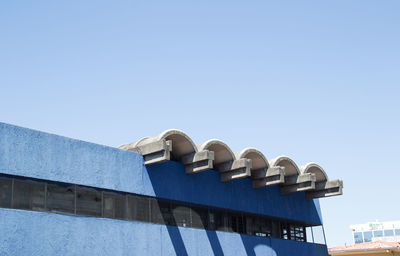 Low angle view of built structure against clear blue sky