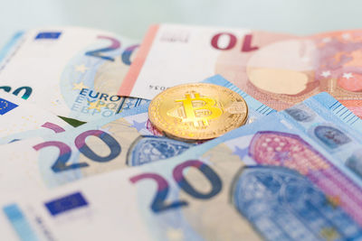 Close-up of coins on table