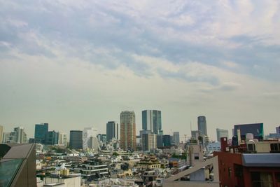 High angle view of buildings in city against sky