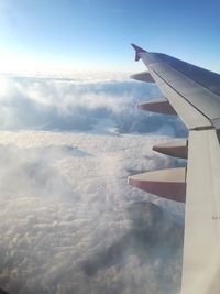 Aerial view of aircraft wing against sky