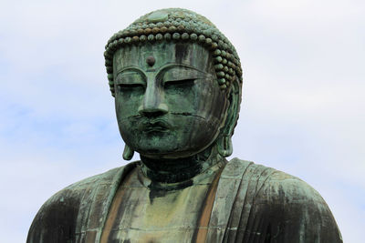 Close-up of statue against sky