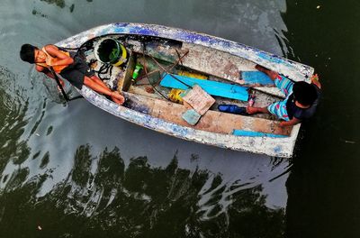 High angle view of boat floating on lake