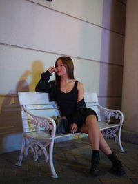 Young woman sitting on chair