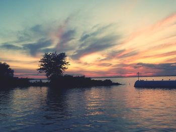 Scenic view of sea against orange sky