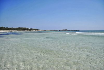 Scenic view of sea against clear blue sky