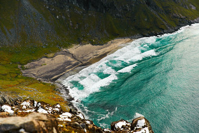 High angle view of rocks by sea