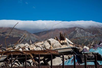 Scenic view of mountains against blue sky