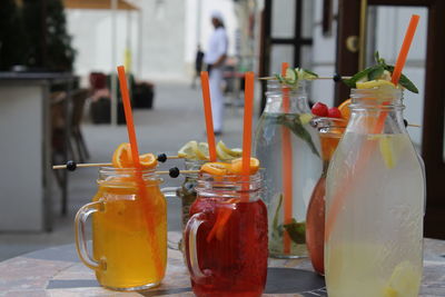 Close-up of drinks in mason jar on table