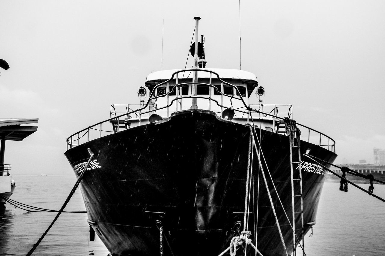 VIEW OF SHIP AT HARBOR AGAINST CLEAR SKY