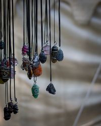 Close-up of jewellery hanging on rope