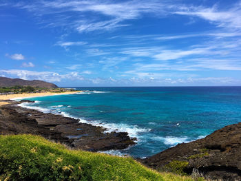 Scenic view of sea against blue sky