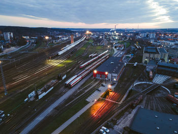 High angle view of illuminated cityscape against sky