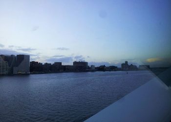 River in city against sky