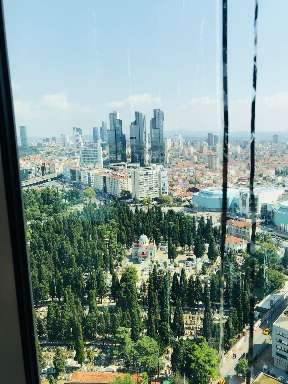 PANORAMIC VIEW OF CITY BUILDINGS AGAINST SKY