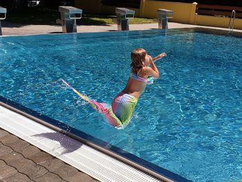 High angle view of woman in swimming pool