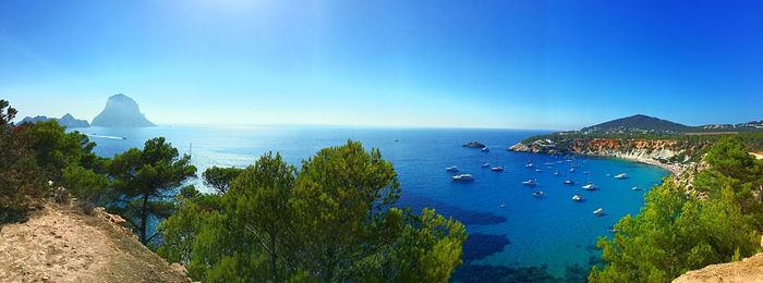 Scenic view of sea against clear blue sky