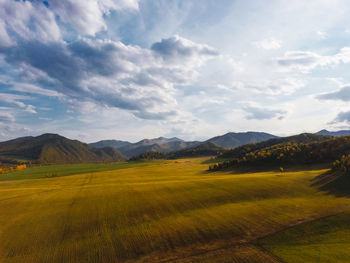 Aerial view of the picturesque autumn mountains with fields drone shooting  autumn backgrounds.