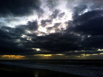 Scenic view of sea against cloudy sky