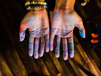 High angle view of woman painting on floor