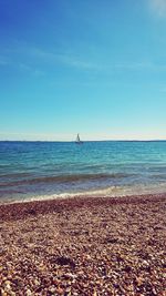 Scenic view of sea against blue sky