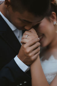 Close-up of couple holding hands