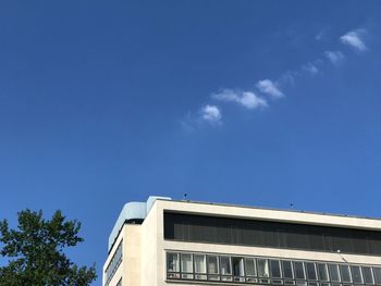 Low angle view of building against blue sky