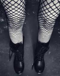 Low section of woman wearing high heels