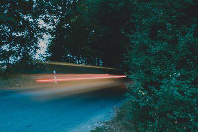 Light trails on road in city at night