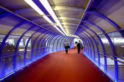 Woman walking in tunnel