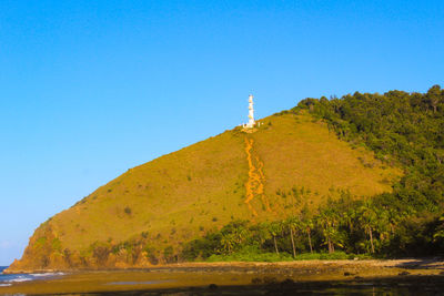 Scenic view of mountains against clear blue sky