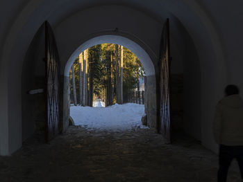 Rear view of building on snow covered footpath