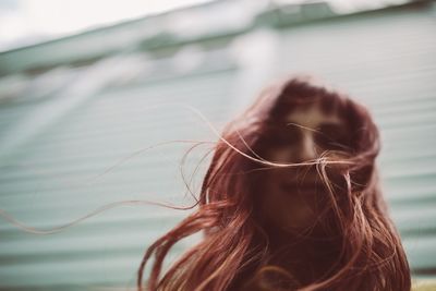 Close-up of redhead woman with messy hair