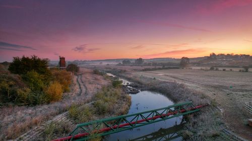 High angle view of river against sky during sunset