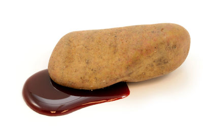 Close-up of bread against white background