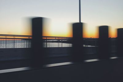 Scenic view of river against clear sky during sunset