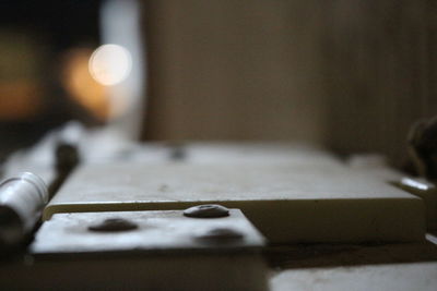 Close-up of electric lamp on table