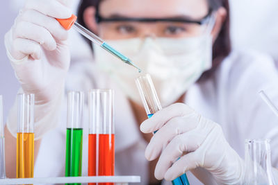 Female scientist holding medical sample at laboratory