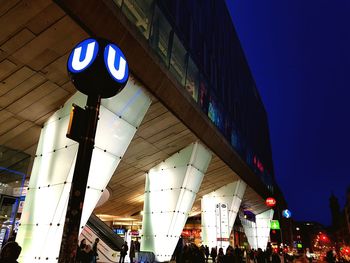 Low angle view of illuminated text at night