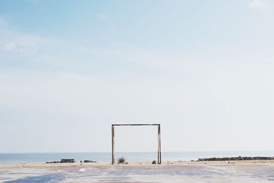 Built structure at beach against sky