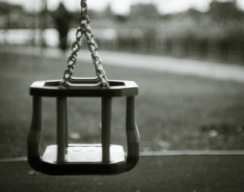 Close-up of empty swing in park