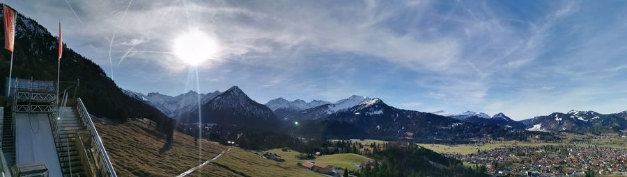 Panoramic view of buildings and mountains against sky